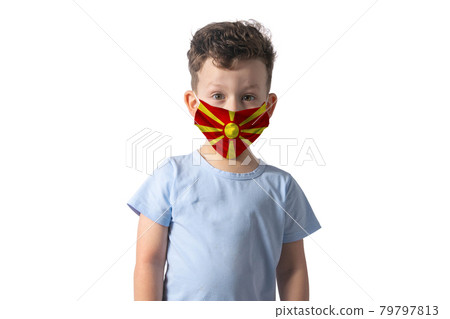 Respirator with flag of Northern Macedonia. White boy puts on medical face mask isolated on white background 79797813