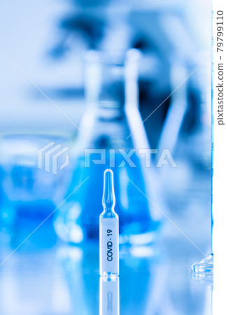 Bottle of COVOD-19 vaccine sample in a laboratory. Idea for researching and lab tests for coronavirus curing. 79799110