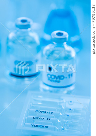 Bottle of COVOD-19 vaccine sample in a laboratory. Idea for researching and lab tests for coronavirus curing. 79799138