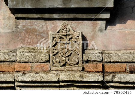 Stone work design and detail at Stone carving work with Javanese and Hindu influences. Located in the Old Grand Mosque of Mataram Kotagede, Jogjakarta Indonesia. Was build circa 1575. Stone work design and detail at Stone carving work with Javanese and Hindu influences. Located in the Old Grand Mosque of Mataram Kotagede, Jogjakarta Indonesia. Was build circa 1575. 79802455
