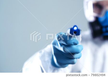 image of an electronic thermometer in the hands of a doctor . image of an electronic thermometer in the hands of a doctor . 79802494