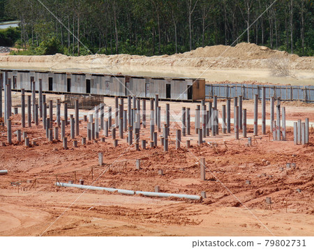 SEREMBAN, MALAYSIA -MARCH 08, 2017: Construction site with piling work is in progress. Piling work is the most popular for the building foundation work. SEREMBAN, MALAYSIA -MARCH 08, 2017: Construction site with piling work is in progress. Piling work is the most popular for the building foundation work. 79802731