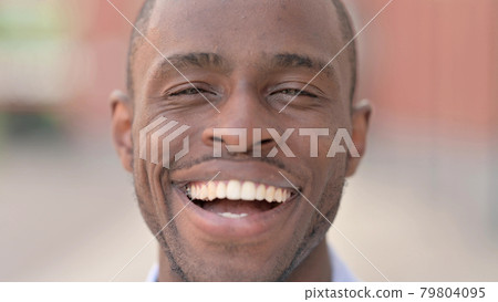 Close Up of Smiling African Man, Outdoor Close Up of Smiling African Man, Outdoor 79804095