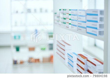 background image of a box of medicines on a shelf in a pharmacy. 79804198