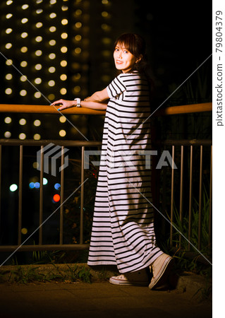 Girls taking a walk in the park at night, avoiding hot hours Girls taking a walk in the park at night, avoiding hot hours 79804379