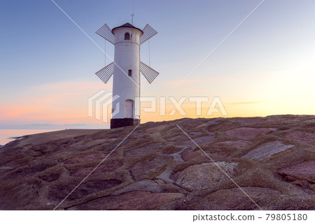 Swinoujscie. The famous mill lighthouse at sunrise. Swinoujscie. The famous mill lighthouse at sunrise. 79805180