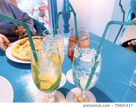 Close-up of a glass with 4 drinks and food Close-up of a glass with 4 drinks and food 79805417