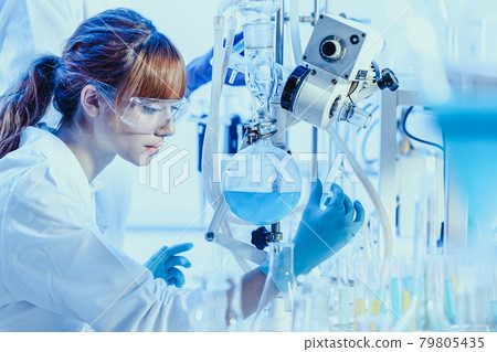 Young chemists researching in life science laboratory. 79805435
