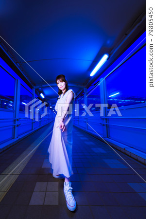 Night play girls waiting for the station to open to return by the first train 79805450