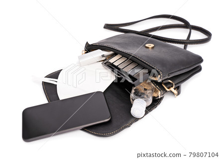 Pandemic female accessories spilling out of a handbag Pandemic female accessories spilling out of a handbag 79807104
