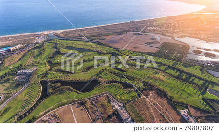 Green golf courses by the sea. Salgados beach. Portugal, Albufeira. Aerial view sunny day 79807807