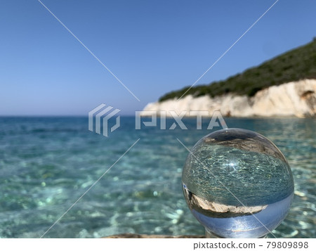 close up crystal glass ball at the beach. close up crystal glass ball at the beach. 79809898