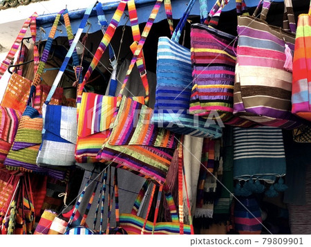 Moroccan multi-colored handmade bags in Medina of Essaouira Moroccan multi-colored handmade bags in Medina of Essaouira 79809901