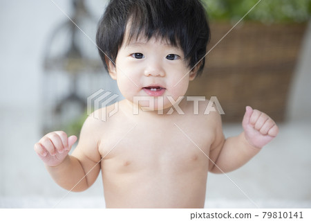 Baby playing with toys 79810141