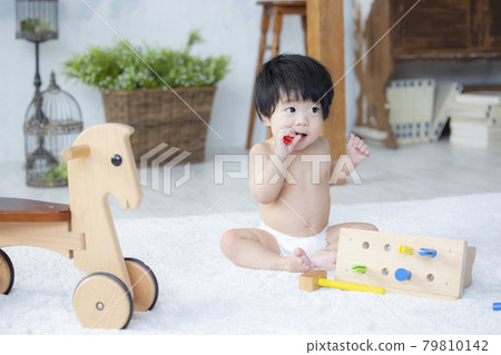 Baby playing with toys 79810142