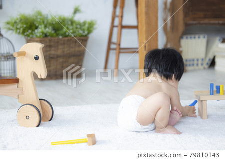 Baby playing with toys 79810143