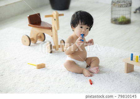 Baby playing with toys 79810145