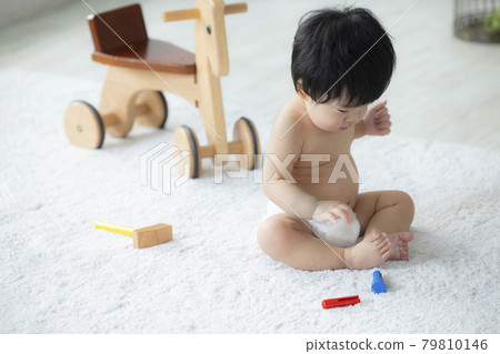 Baby playing with toys 79810146