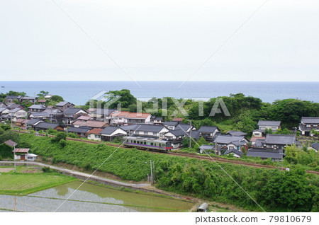 Regular train (Kiha 121) that goes along the Sea of Japan on the San-In Line 79810679
