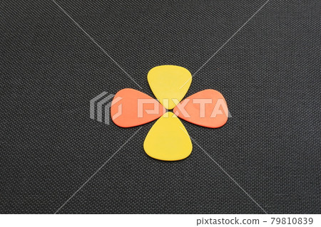 Design of guitar picks arranged in the shape of petals Design of guitar picks arranged in the shape of petals 79810839
