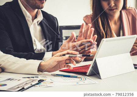 Businessman and businesswomen working in office. Businessman and businesswomen working in office. 79812356
