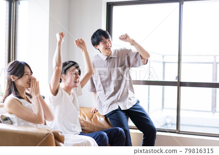 Young men and women who get excited by watching sports Young men and women who get excited by watching sports 79816315