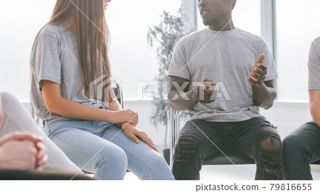 handsome guy telling his ideas to a group of like-minded people. 79816655