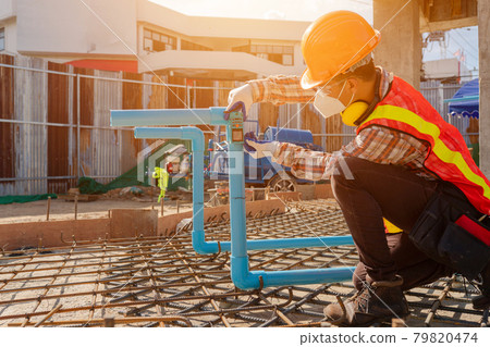 Constructions concept worker at the construction site Constructions concept worker at the construction site 79820474