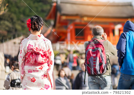 young woman tourist wearing kimono enjoying with colorful leaves in Kiyomizu dera temple, Kyoto, Japan. Asian girl with hair style in traditional Japanese clothes in Autumn foliage season young woman tourist wearing kimono enjoying with colorful leaves in Kiyomizu dera temple, Kyoto, Japan. Asian girl with hair style in traditional Japanese clothes in Autumn foliage season 79821302