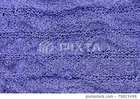 Natural woolen fabric fragment. Knitted texture closeup. Warm yarn background. Natural woolen fabric fragment. Knitted texture closeup. Warm yarn background. 79821498