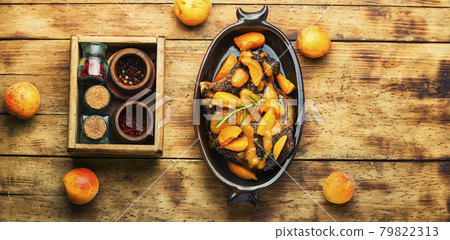 Veal steak fried with apricots Veal steak fried with apricots 79822313