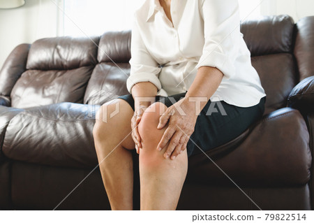 senior woman suffering from knee pain at home, health problem concept senior woman suffering from knee pain at home, health problem concept 79822514