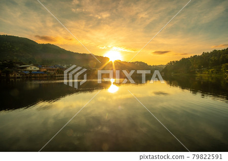 Beautiful of lake view in the morning sunrise, Ban Rak Thai village, landmark and popular for tourists attractions, Mae Hong Son province, Thailand. Travel concept Beautiful of lake view in the morning sunrise, Ban Rak Thai village, landmark and popular for tourists attractions, Mae Hong Son province, Thailand. Travel concept 79822591