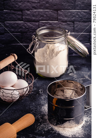 Table with baking products and tools. 79824131