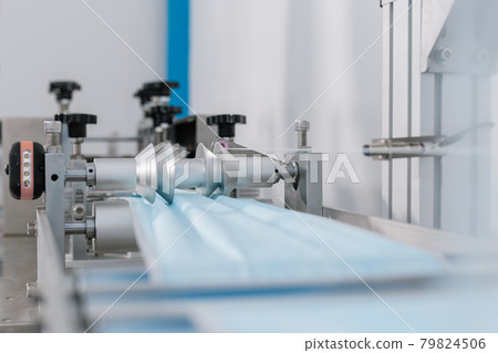 mask factory industry manufacturing line produces. equipment protection covid-19. 79824506