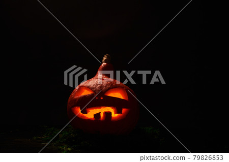 Pumpkin with burning mouths and eyes on blank black background. Jack-o-lantern decoration. Pumpkin with burning mouths and eyes on blank black background. Jack-o-lantern decoration. 79826853