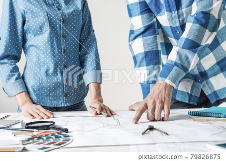 Man and woman together working at design project 79826875