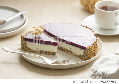 Whole cheesecake with berries and green mint. Gluten and sugar free vegan, healthy cake. 79827763