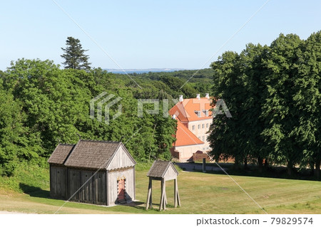 View of Moesgaard with the viking church in Denmark 79829574