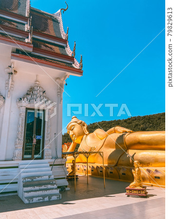 Wat Khao Sung Chaem Fa temple with giant snake and reclining gold buddha, in Kanchanaburi, Thailand Wat Khao Sung Chaem Fa temple with giant snake and reclining gold buddha, in Kanchanaburi, Thailand 79829613