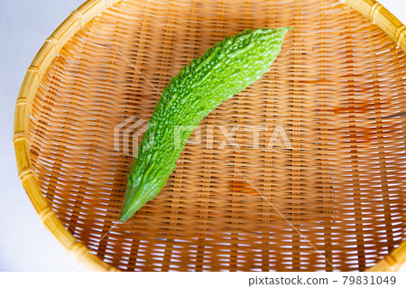 Harvesting in the vegetable garden. Freshly picked bitter gourd 79831049
