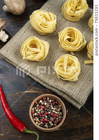 Italian rolled fresh fettuccine pasta. Italian food concept. 79833291