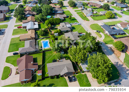 Aerial view panorama of a Clinton small town city of residential district at suburban development with an Oklahoma US 79835934
