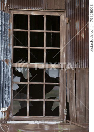 A window with broken glass A window with broken glass 79836008