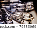 Several halogen small incandescent lamps with a blurry background 79836069