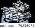 Several halogen small incandescent lamps with a blurry background 79836072