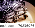Several halogen small incandescent lamps with a blurry background 79836076