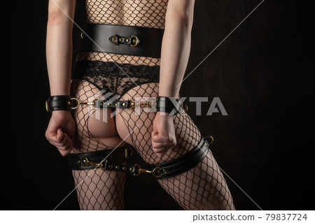 Sexy lady in bdsm outfit. Beauty woman with attractive Sexy lady in bdsm outfit. Beauty woman with attractive 79837724