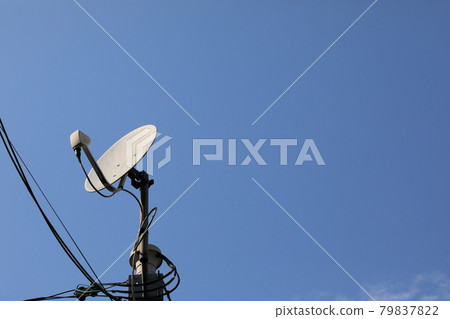 Blue sky and old satellite dish 79837822