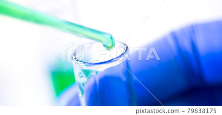 Chemical test tubes and pipette with green liquid close up in a chemical laboratory 79838175